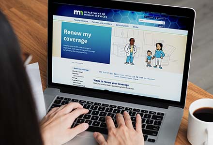 Laptop with web page for Minnesota Department of Human Services Healthcare Renewal Campaign